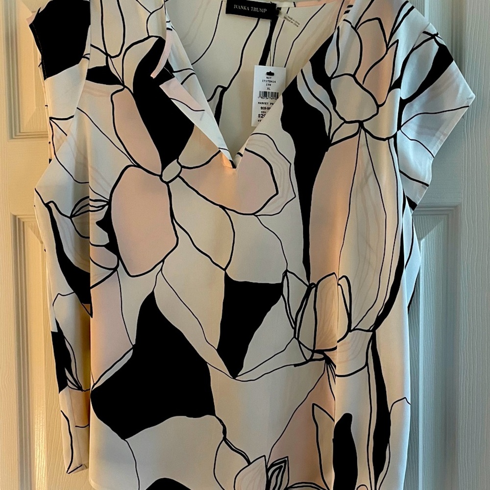 White, pink and black print blouse.  Very nice!